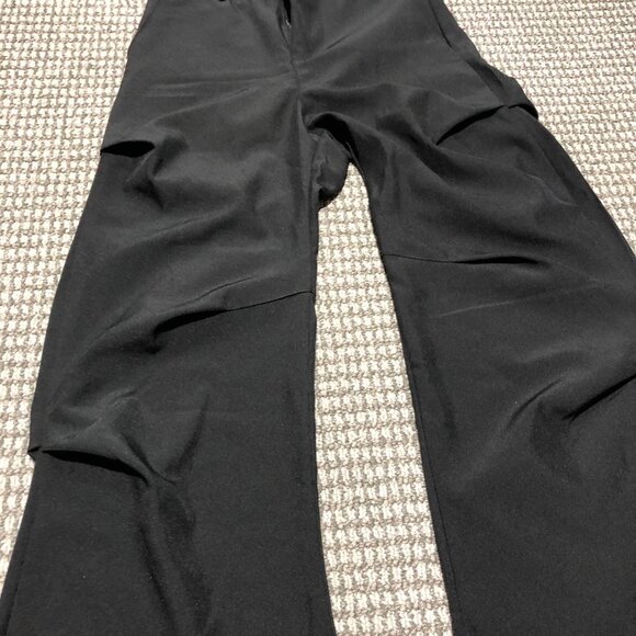 Black baggy slacks with folds. Beautiful peice, the folds make it sit right, so - Picture 2 of 6